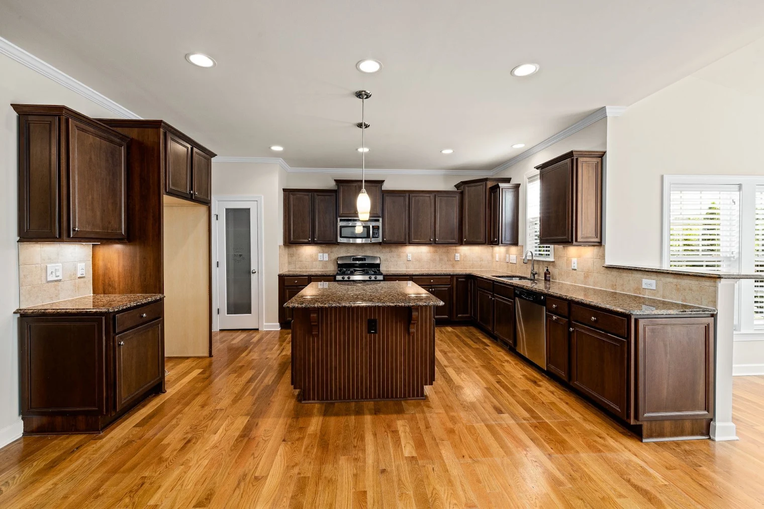 A residential kitchen after a recent recessed lighting installation.
