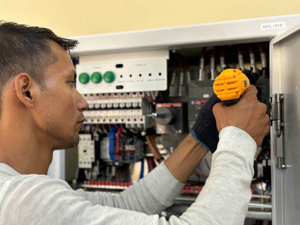 a professional electrican upgrading an electrical panel