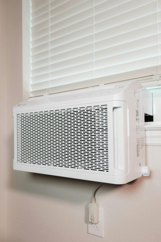 A window unit air conditioner in a window in a Chester County, PA home during summer